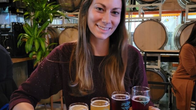 Melissa with her flight at Speciation Speciation Ales