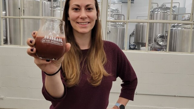 Melissa drinking the Chocolate Dip beer Arvon